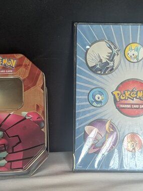 Pokémon tin card holder and card album.